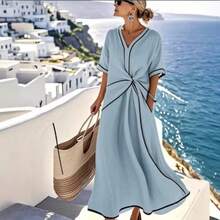 Vestido de mujer color albaricoque con detalles en contraste negro, escote en V, corte en la cintura con volantes, bolsillos laterales, tejido ligero ideal para verano, estilo casual elegante perfecto para vacaciones, playa y viajes, moda resort - Albaricoque - Ver 6