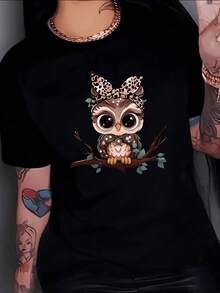 Adorable Owl With A Tender Gaze Sitting On A Branch Symbolizing Wisdom And Calm, Surrounded By Green Leaves And A Printed Bow Reflecting Confidence And Positive Energy. Comfortable Women's T-Shirt For Everyday Wear, Modern And Attractive - 黑色 - 查看 8