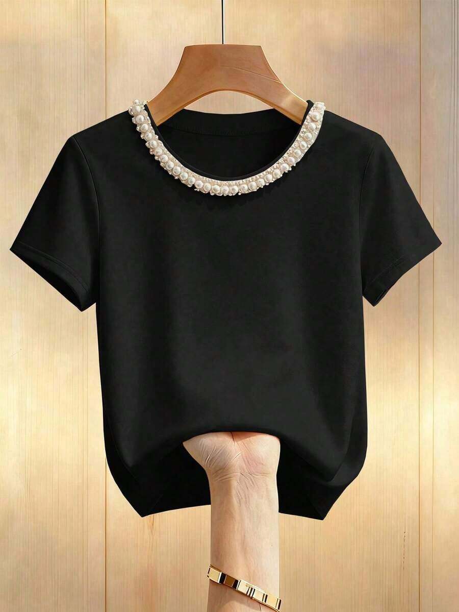 Desde la primavera hasta el verano, nuevas llegadas en la parte superior de verano: Día de San Valentín, elegante parte superior de mujer, parte superior de color albaricoque, camiseta, cuello redondo, adornos con cuentas, mangas cortas, estiliza - Negro - Ver 1