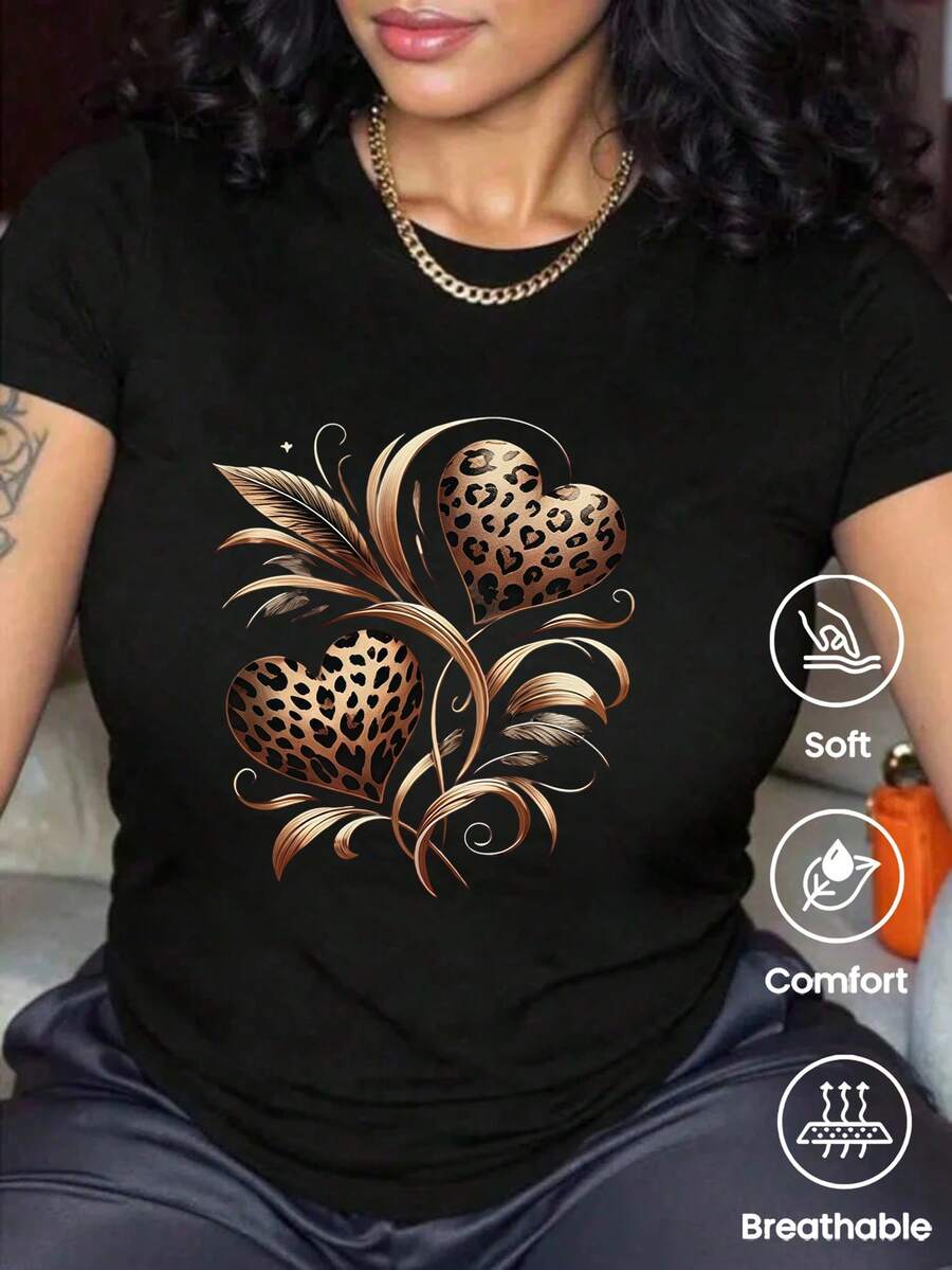 Esta camiseta de manga corta, cuello redondo y corte holgado, es perfecta para ocasiones informales y elegantes. Presenta un estampado de leopardo y corazones, ideal para vacaciones, la oficina, salidas, el día a día, citas, fiestas, reuniones y estilo urbano. Esta versátil prenda deportiva informal también es un regalo perfecto para diversas ocasiones. - Negro - Ver 1