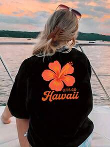 Camiseta de mujer con estampado floral amarillo estilo hawaiano "Let's Go Hawaii" - Diseño floral tropical y naranja brillante, top casual de manga corta y cuello redondo, adecuada para ropa de playa en primavera y verano, regalos de cumpleaños y Navidad, atuendos para fiestas temáticas hawaianas y ropa de vacaciones. - Negro - Ver 3