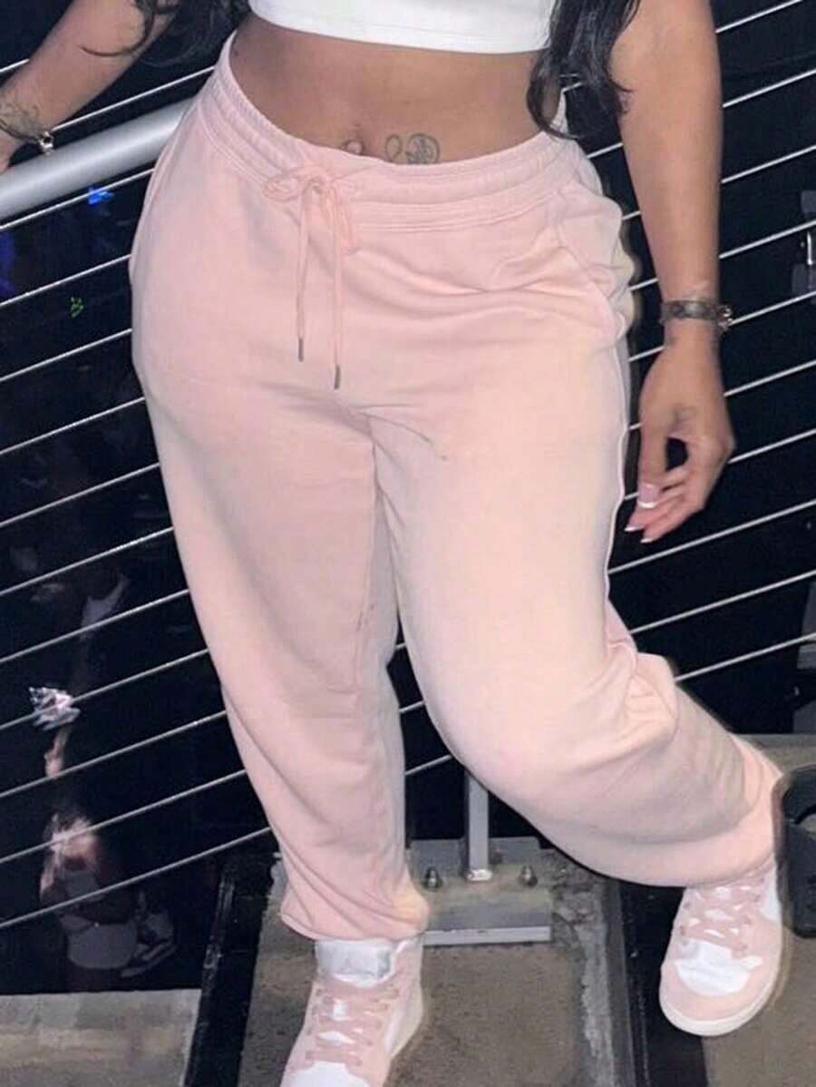 Pantalones deportivos jogger de mujer con unicolor, cintura con cordón y bolsillos - Rosa Pálido - Ver 1