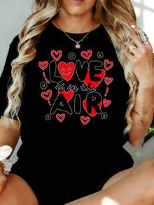 Camiseta con Estampado de Corazón 'El Amor Está en el Aire' para Mujer, Estilo Casual, para el Día de San Valentín, 180g, para Ocio en Casa, al Aire Libre, Regalo para Fiesta de San Valentín - Negro - Ver 1
