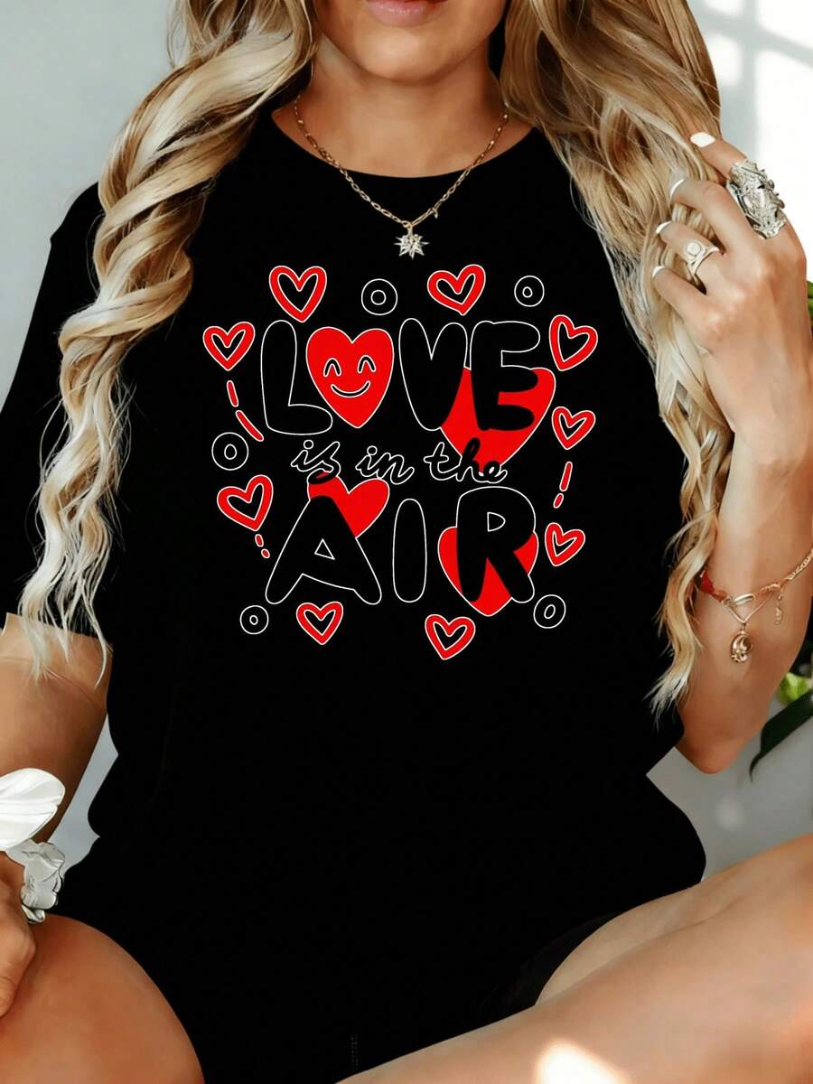 Camiseta con Estampado de Corazón 'El Amor Está en el Aire' para Mujer, Estilo Casual, para el Día de San Valentín, 180g, para Ocio en Casa, al Aire Libre, Regalo para Fiesta de San Valentín - Negro - Ver 1