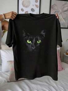 Envío gratis, entrega local enéxico, entrega en 4 días. Camiseta de mujer con gato negro de ojos verdes - Estilo casual oversize negro. - Negro - Ver 2