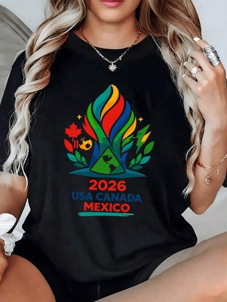 Fuego multicolor que simboliza la unión de naciones y la pasión del fútbol con hojas verdes que representan crecimiento y energía camiseta de mujer moderna cómoda para celebrar espíritu deportivo 2026 USA Canadá México - Negro - Ver 1