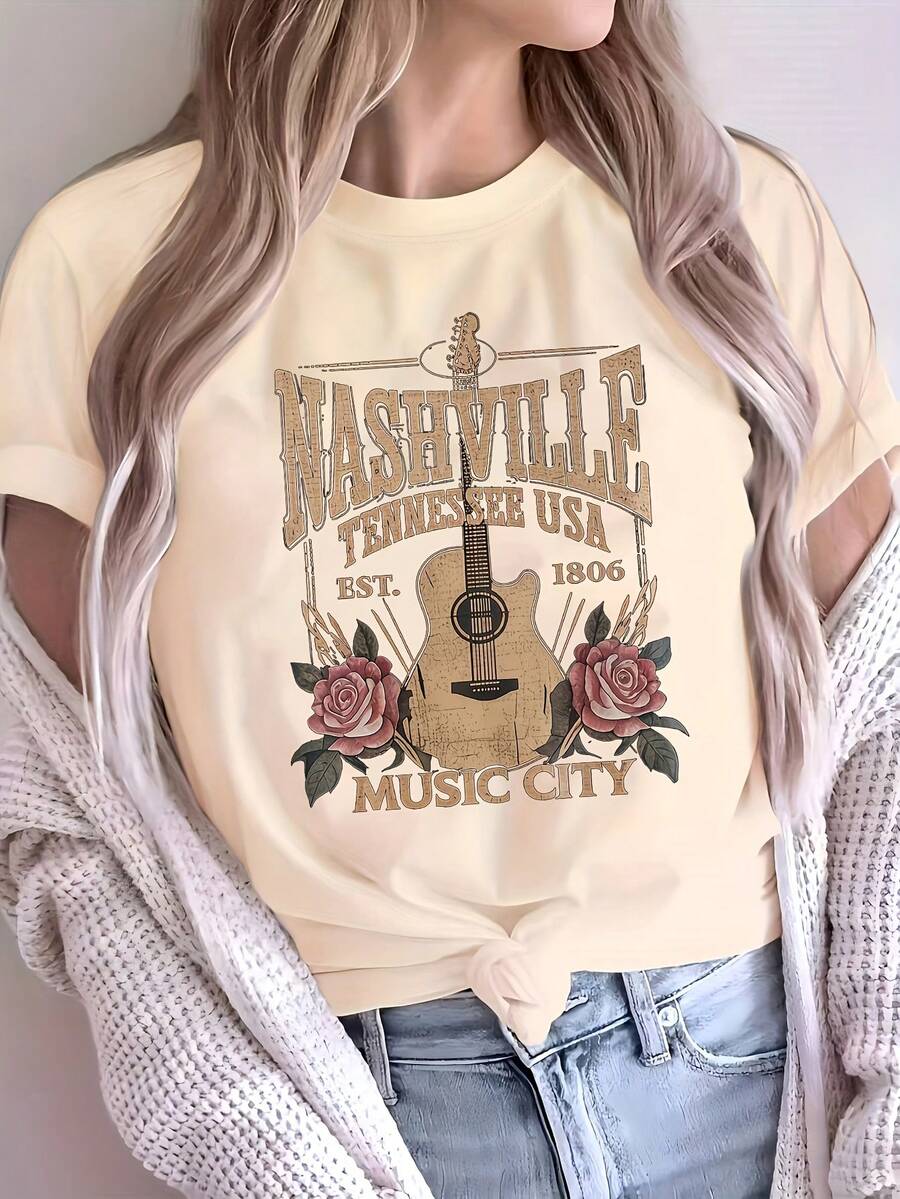 Camiseta de mujer cómoda, negra, con estampado de guitarra, corte holgado, cuello redondo, manga corta, tela suave y ligeramente elástica, uso casual diario, patrón geométrico, primavera-verano, longitud regular, sin cinturón, estilo pullover. - Albaricoque - Ver 1