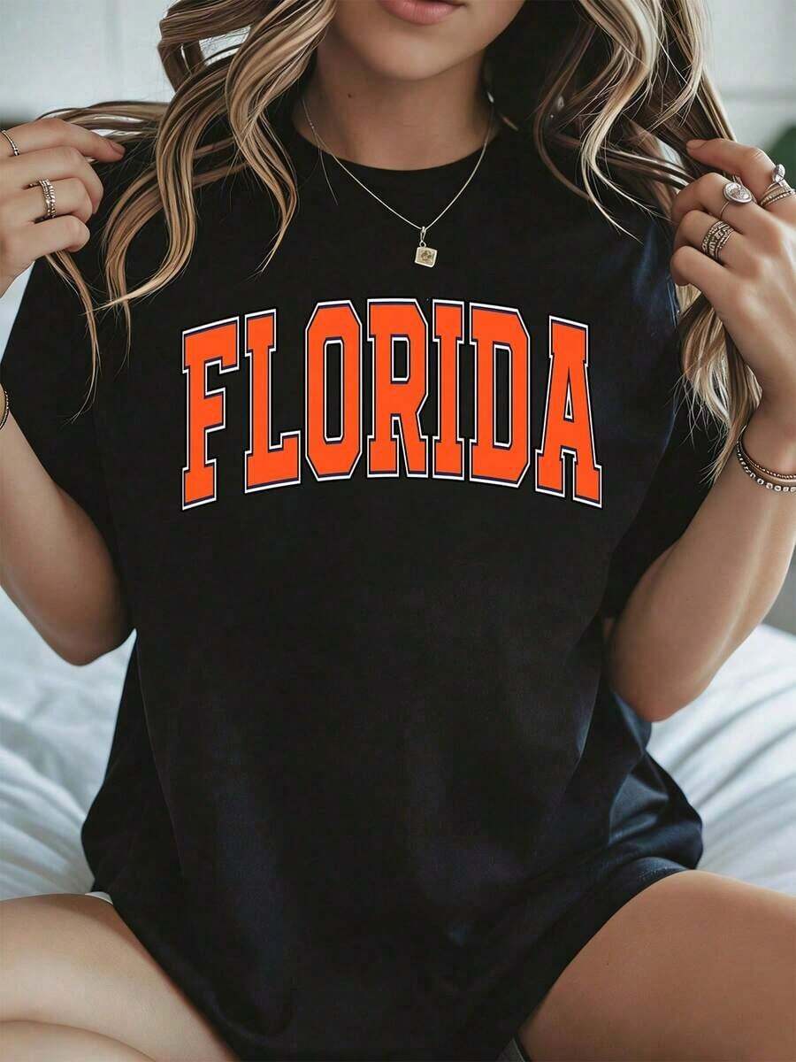 Elegante y casual, camiseta de manga corta para mujer, con cuello redondo, con el logo de la Universidad Estatal de Florida, estampado naranja, color negro, ropa casual para la temporada primavera-verano. - Negro - Ver 1