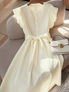Vestido de mujer de longitud media, cómodo y suave, sin estiramiento, con cuello redondo, mangas de vuelo, cintura elástica, decoración de botones de perla, estilo francés elegante y versátil para vacaciones y viajes, color albaricoque, primavera - Albaricoque - Ver 6