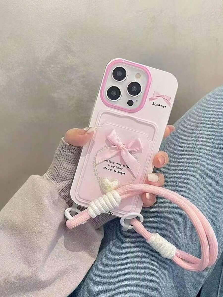 Ốp lưng điện thoại kèm dây đeo và giá đựng thẻ hoa 3D nhiều màu, tương thích với iPhone 16 Pro Max/15 Pro Max, New 11, 12, 14 Pro/13, ốp bảo vệ mềm sáng tạo tương thích với iPhone 17 Pro Max/17/Pro/17 Plus/17, phong cách Ins mùa hè - Nơ hình trái tim màu hồng - Xem 1