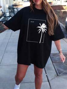 Camiseta de mujer de corte holgado con hombros caídos y estampado de palmeras, manga corta, cuello redondo, estilo casual, talla grande, ideal para vacaciones de verano. - Negro - Ver 1