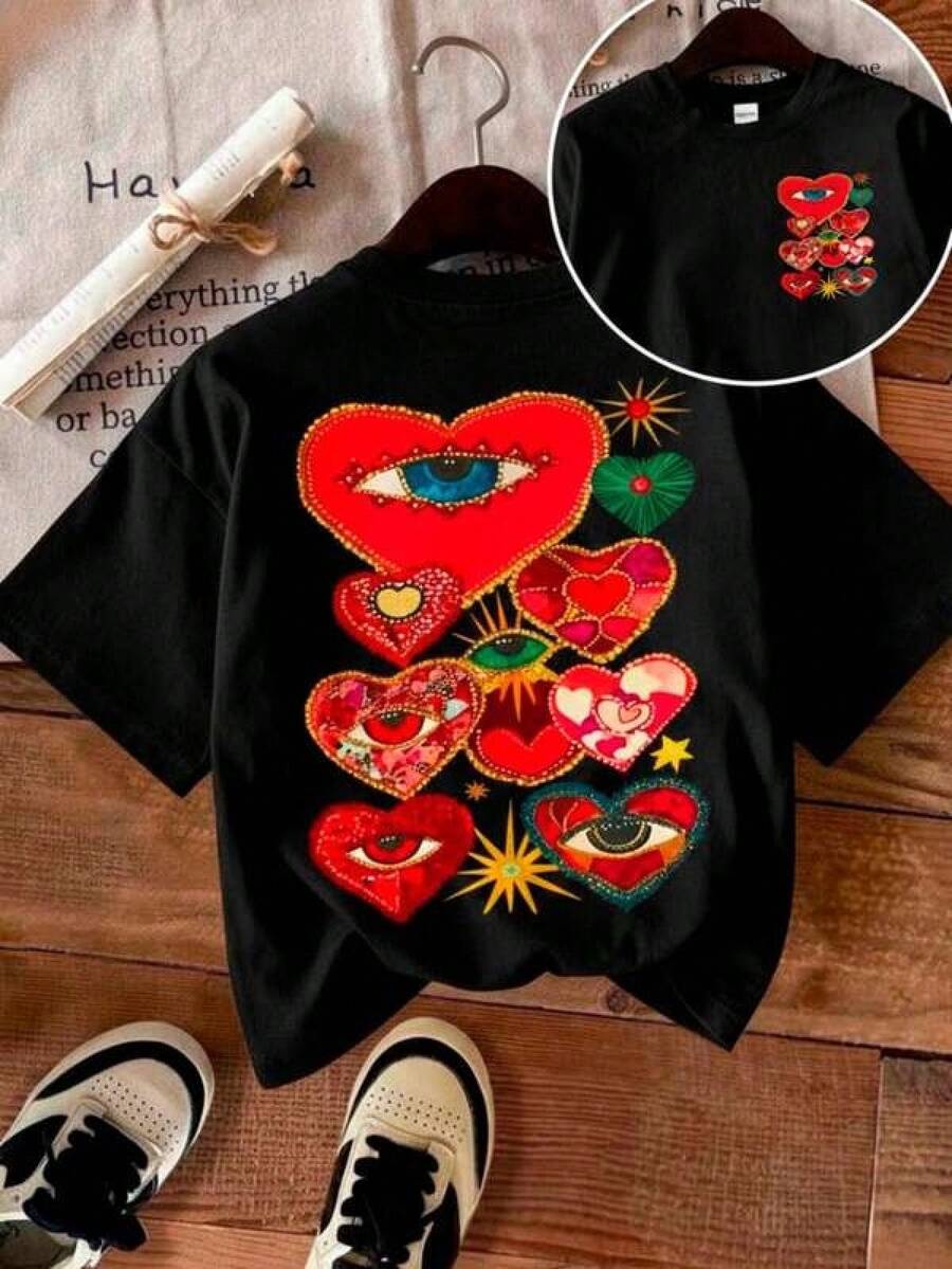 Playera unisex de manga corta y cuello redondoPlayera con diseño de ojos adentro de corazones, estampado, casual, cuello redondo, manga corta, ideal para todos los días, llamativa, moderna, holgada, a la moda, ideal para tí.2026 - Negro - Ver 1