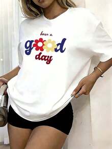PremiumCamiseta Holgada para Mujer Blanca con Estampado "Have a Good Day" con Flores Coloridas, Cuello Redondo de Manga Corta, Top Casual Inspirador, Ropa Cómoda para Uso Diario y Ocasiones Informales, Estilo Primaveral Eco-Friendly - Blanco - Ver 1