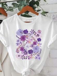 Camiseta suave 100% algodón de manga corta con cuello redondo para mujer, estampado de flores variadas en tonos morados románticos, top casual versátil con estilo suave. Camiseta de algodón transpirable, combina con todo. - Blanco - Ver 6