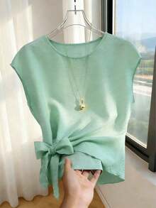 Blusa casual y versátil de cuello redondo elegante, con detalle de lazo en el bajo asimétrico, blusa de mujer de manga corta color albaricoque - verde menta - Ver 1