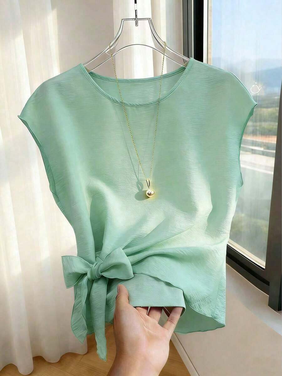 Blusa casual y versátil de cuello redondo elegante, con detalle de lazo en el bajo asimétrico, blusa de mujer de manga corta color albaricoque - verde menta - Ver 1