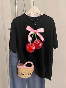 Camisetas de manga corta de talla grande para mujer, ideales para el verano y el uso diario, nuevas camisetas de mujer 2026 con estampado de cerezas y lazo rosa, un regalo de verano a la moda, adecuadas para fiestas y uso diario, transpirables y cómodas. - Negro - Ver 1