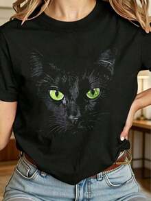Envío gratis, entrega local enéxico, entrega en 4 días. Camiseta de mujer con gato negro de ojos verdes - Estilo casual oversize negro. - Negro - Ver 1