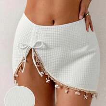 Falda de punto negra para cubrir el bikini con decoración de conchas y estrellas de mar, con abertura sexy. - Blanco - Ver 4