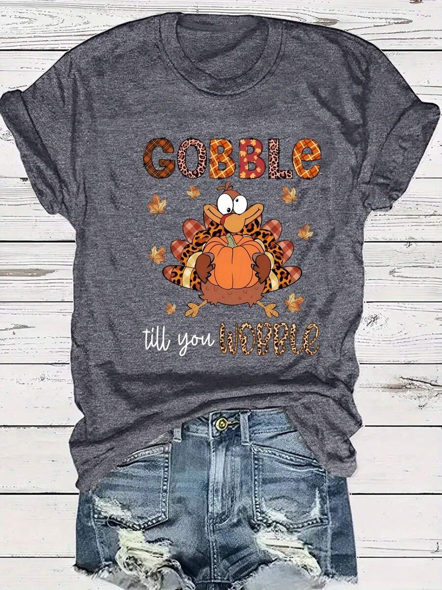 Camiseta Gráfica Rosa de Talla Grande para Mujer con la Frase "Gobble Till You Wobble" - Cuello Redondo Casual, Manga Corta, Diseño Temático de Otoño y Halloween con Calabaza y Hojas de Otoño, Ropa Casual|Estampado Divertido|Tela Elástica - Gris Oscuro - Ver 1
