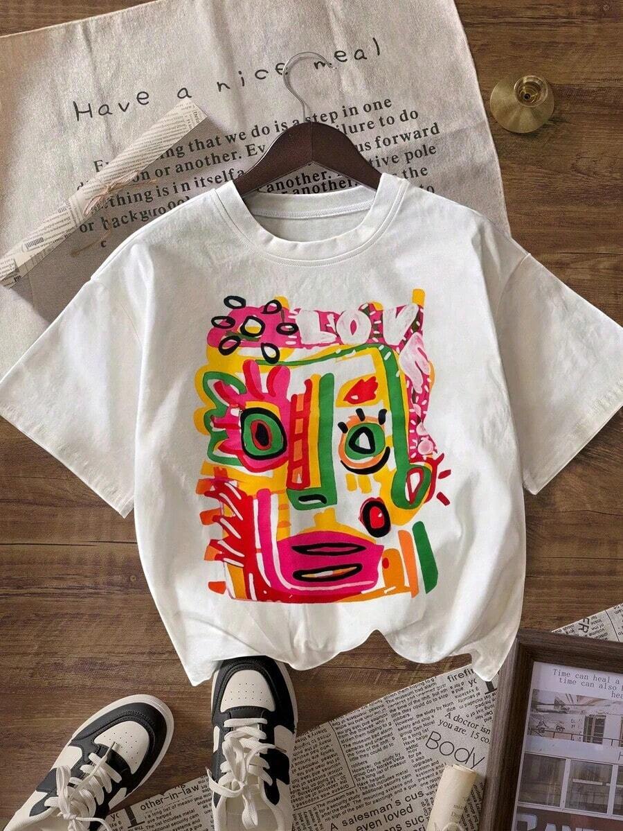 Camiseta de Mujer Casual de Corte Holgado con Estampado Abstracto de Rostro de Graffiti, Transpirable y Cómoda, Manga Corta, Cuello Redondo, Estampado Colorido Inspirado en Basquiato, Algodón Suave, Perfecta para Uso Diario y Estilo Urbano Artístico - Blanco - Ver 1