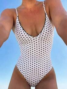 Traje de baño de una pieza con tirantes ajustables y reversible con base amarilla y lunares marrones + rayas marrones y amarillas, Primavera/Verano 2026 - Blanco y Negro - Ver 9