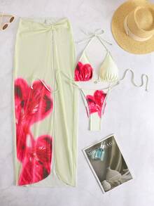 Bộ bikini nữ in họa tiết, kiểu cổ yếm, chất liệu co giãn cao và chân váy xẻ tà hơi xuyên thấu, thích hợp đi biển. - Nhiều màu - Xem 2