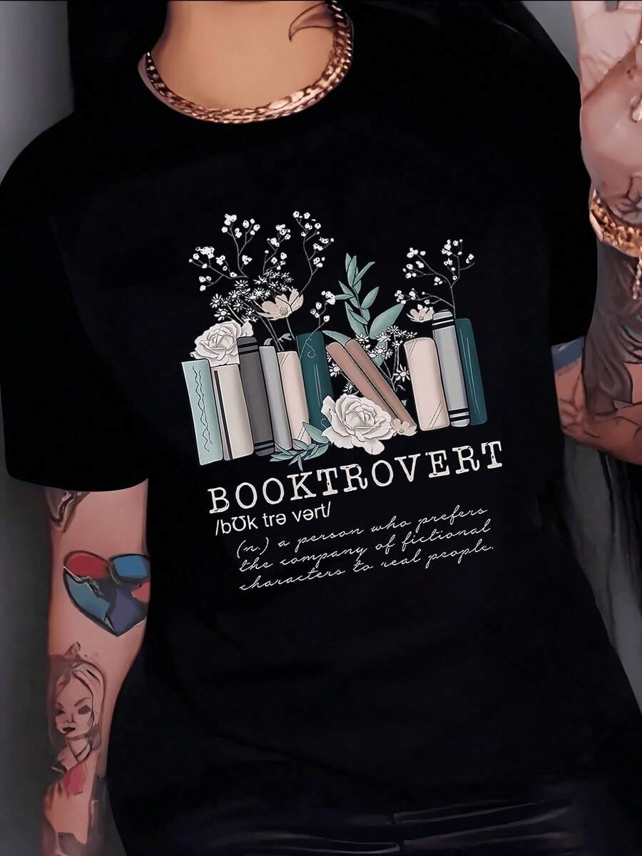 Libros apilados con flores blancas y ramas verdes simbolizan amor por la lectura y tranquilidad interior reflejando una mente curiosa y creativa camiseta de mujer casual cómoda para uso diario - Negro - Ver 1