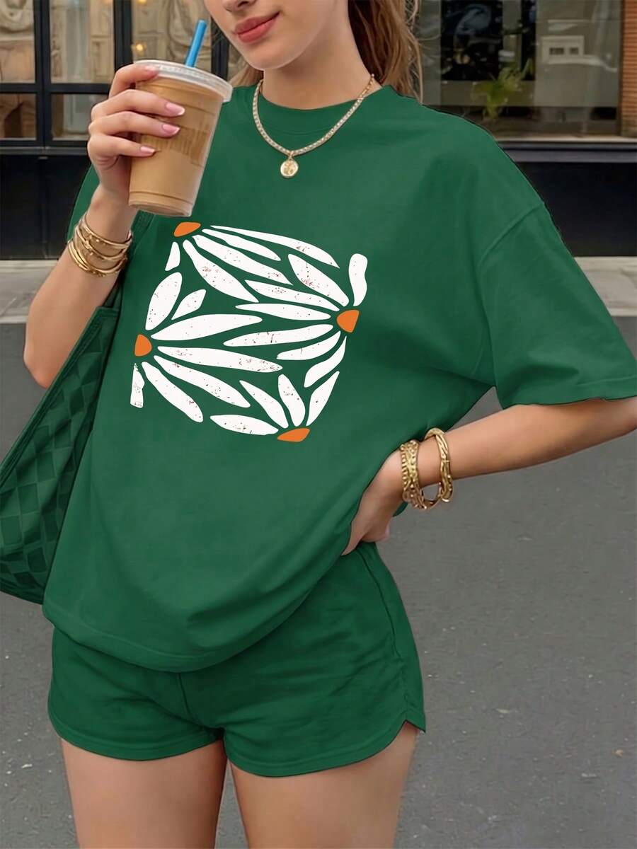 Suave camiseta básica de moda primavera/verano para mujer, de manga corta y cuello redondo, con un patrón abstracto de pétalos blancos, adornada con puntos naranjas, con un efecto de textura desgastada, adecuada para uso casual, se puede usar en casa o al aire libre, camiseta ajustada versátil en varios colores, material cómodo, para entusiastas de la moda, blusas elegantes para mujer. - Verde - Ver 1