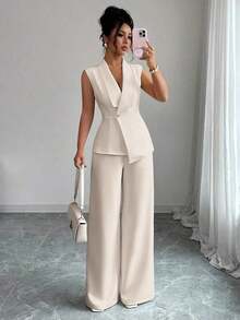 Conjunto de oficina elegante para mujer, compuesto por una chaqueta blazer sin mangas con cuello y bajo asimétrico, con hebilla metálica en la cintura, combinada con pantalones de cintura elástica.Conjunto de 2 piezas elegante para primavera/verano, atuendo formal y de clase para mujer. - Albaricoque 2 - Ver 1