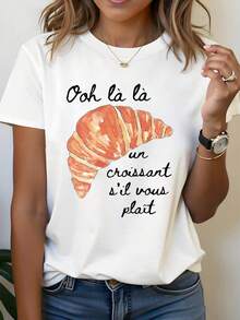 Estilo francés, un favorito de los amantes de los croissants. Camiseta de moda casual para mujer, de talla grande, con estampado francés "Ooh là là un croissant s'il vous plaît", cuello redondo, para primavera-verano, blusas para mujer. - Blanco - Ver 1