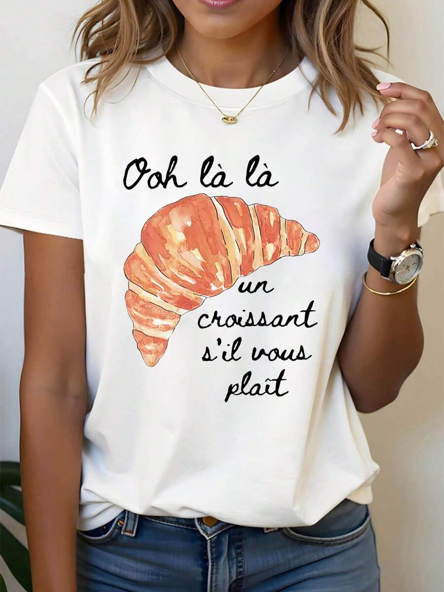 Estilo francés, un favorito de los amantes de los croissants. Camiseta de moda casual para mujer, de talla grande, con estampado francés "Ooh là là un croissant s'il vous plaît", cuello redondo, para primavera-verano, blusas para mujer. - Blanco - Ver 1