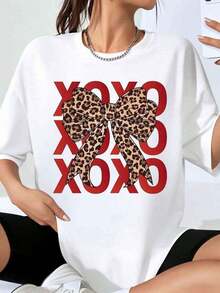 Camiseta Oversize con Estampado de Lazo de Leopardo GraphicXoxo para Mujer, Estilo Casual Holgado, Camiseta Gráfica de Moda de Verano, Estilo Streetwear - Blanco - Ver 1