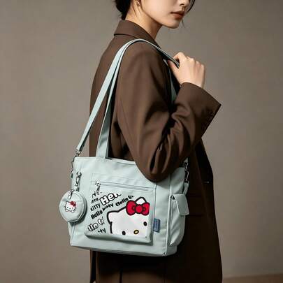 Miniso 三丽鸥Hello Kitty涂鸦印花薄荷绿休闲多功能大容量手提包两件套，带可拆卸零钱包，多种携带方式，适合工作、旅行、购物和日常使用。