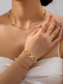 Bộ 5 món trang sức hình cỏ ba lá thanh lịch: Dây chuyền mặt dây hình cỏ ba lá rỗng, vòng tay mặt dây hình cỏ ba lá nhiều lớp, vòng đeo tay hình cỏ ba lá hở, nhẫn hình cỏ ba lá hở, lắc chân hình cỏ ba lá nhiều lớp, phù hợp với trang phục thường ngày và ngày lễ của phụ nữ. - Vàng - Xem 2