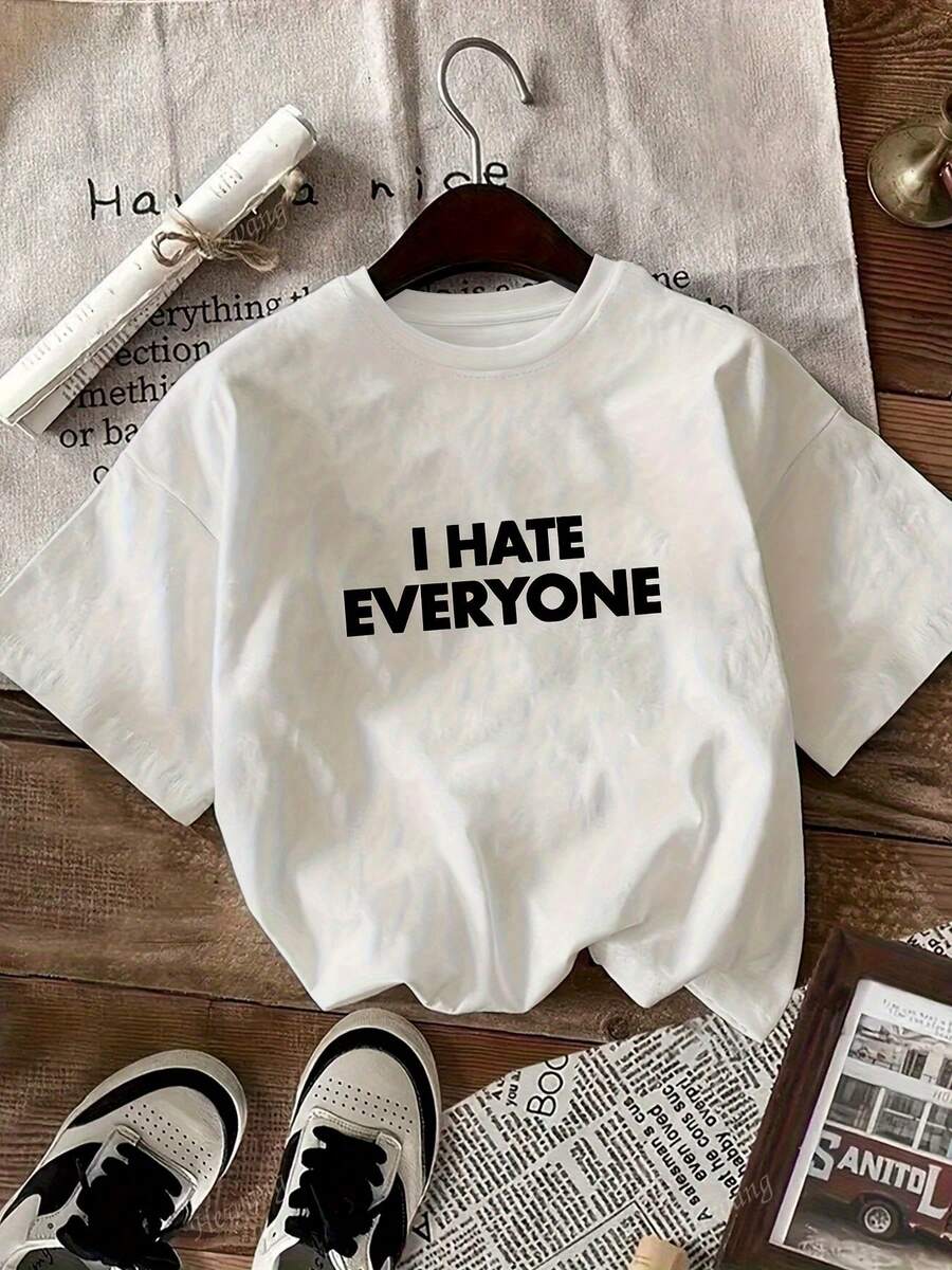 Women's Printed T-Shirt - Casual Short Sleeve Crew Neck T-Shirt In Oversized Size, White With Bold Black Text. Relaxed Fit For All Seasons, Perfect For Everyday Wear And Holiday Outfits, Displayed On A Wooden Surface (Machine Washable). - 白色 - 查看 1