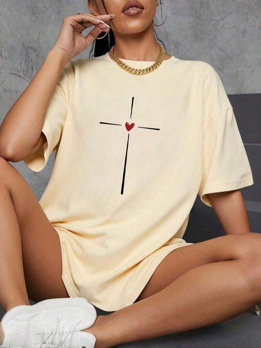 Camiseta de manga corta con cuello redondo para mujer, ideal para el verano, con estampado de corazón y cruz.Estilo casual y versátil.Corte regular. - Blanco - Ver 1
