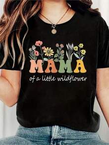 Camiseta casual de algodón de manga corta con cuello redondo y estampado floral para mujer, 100% algodón, con la frase 'Mamá de una pequeña flor silvestre', para primavera y verano. Moda. - Negro - Ver 1