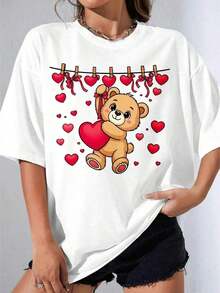 Camiseta Blanca y Negra para Niña con Estampado de Oso Lindo Sosteniendo un Corazón, Oso de San Valentín Blanco con Corazones Colgantes, para Uso Casual y Ocasiones Románticas, Fiesta al Aire Libre, Camiseta Casual Estampada - Estilo Vintage Urbano, Unisex, de Algodón, Manga Corta, Cuello Redondo, Blusas para Mujer. blusas.blusas casuales para dama.Impresión de osos cariñosos.Camiseta estampada Impresión de osos cariñosos. - Blanco - Ver 1