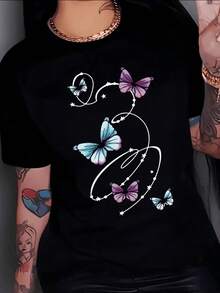 Butterflies Representing Freedom, Hope, And Transformation Rise Among Lines Of Stars, Symbolizing Dreams Taking Flight, Inspiring Joy And Lightness. A Modern, Comfortable, Casual Women's T-Shirt For Everyday Wear. - 黑色 - 查看 8