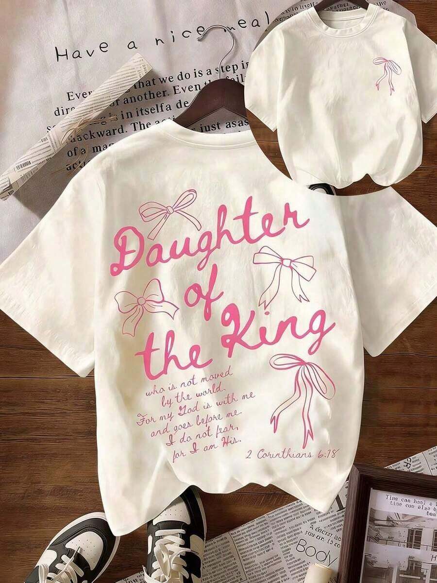 Camiseta Gráfica 'La Hija del Rey', Ropa de Fe con Estética Bíblica para Mujer, Camiseta Casual de Manga Corta con Cuello Redondo y Texto Impreso en la Espalda - Albaricoque 4 - Ver 1