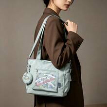 Miniso Bộ 2 túi tote đa năng cỡ lớn in hình Cinnamoroll Fruit Party của Sanrio, màu xanh bạc hà, kèm ví đựng tiền xu có thể tháo rời, có thể mang theo nhiều cách, lý tưởng cho công việc, du lịch, mua sắm và sử dụng hàng ngày. - Màu xanh Bạc hà - Xem 1