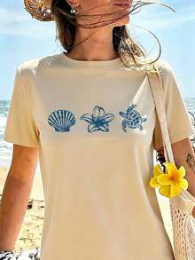 Camiseta de verano de manga corta para mujer, corte holgado, cuello redondo, en azul claro, con estampados casuales de letras, animales marinos, caparazones de tortuga y flores, ideal para uso diario y vacaciones. - Caqui - Ver 11