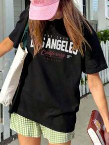 Camiseta de manga corta para mujer, estilo casual de verano, con estampado de eslogan de Los Ángeles, holgada y versátil, con cuello redondo, ideal para uso diario y vacaciones. - Negro - Ver 7
