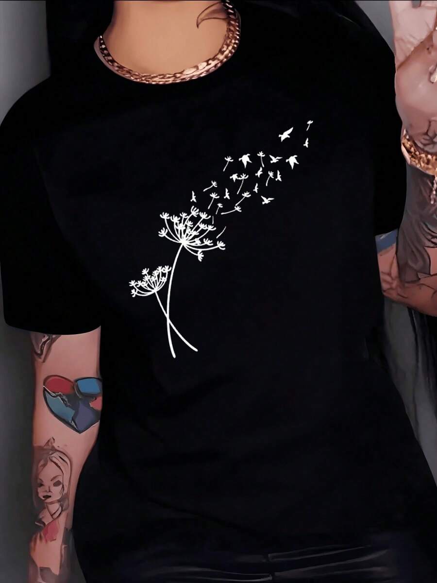 Flores silvestres que se transforman en aves simbolizando libertad esperanza y renovación interior en un vuelo poético que une la naturaleza con el alma camiseta de mujer casual moderna cómoda para uso diario - Negro - Ver 1