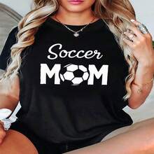 Camiseta informal de algodón de manga corta y cuello redondo para mujer con estampado de "Soccer Mom" (Mamá de futbolista) y corte regular. - Negro - Ver 1