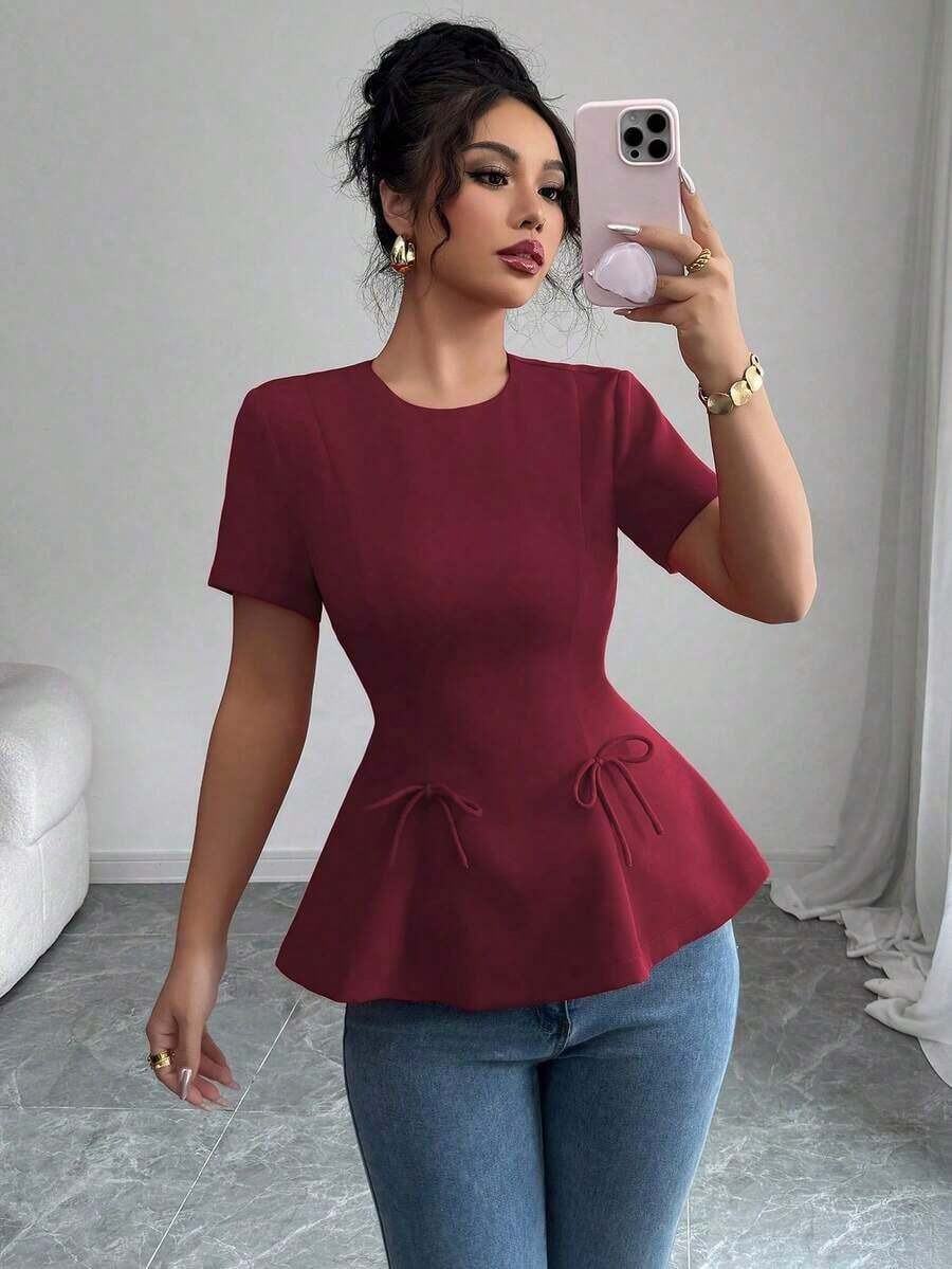 Blusa casual de primavera y verano, elegante, de estilo francés, de unicolor, con cuello redondo, corte evasé, manga corta, con cintura ceñida, detalle de lazo y cremallera posterior - Granada - Ver 1