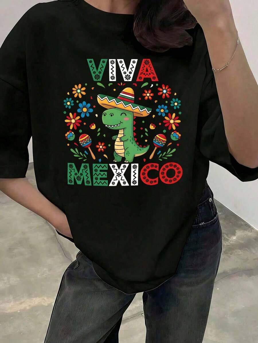 Playera negra para mujer de cuello redondo, manga corta, estampado "Viva México" con dinosaurio kawaii con sombrero charro, flores y maracas, temática patriota y divertida, ideal para fiestas nacionales, uso diario, casual, verano, algodón100% Cotton - Negro - Ver 1