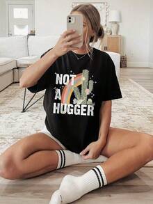1 Pieza Camiseta Unisex Holgada 180g 100% Algodón Puro, Camiseta Y2K Not a Hugger con diseño de cactus y arcoíris perfecta para un look fresco y moderno ideal para destacar tu estilo único en cualquier ocasión. Hazte notar con esta pieza única que combina comodidad y originalidad. - Negro - Ver 6