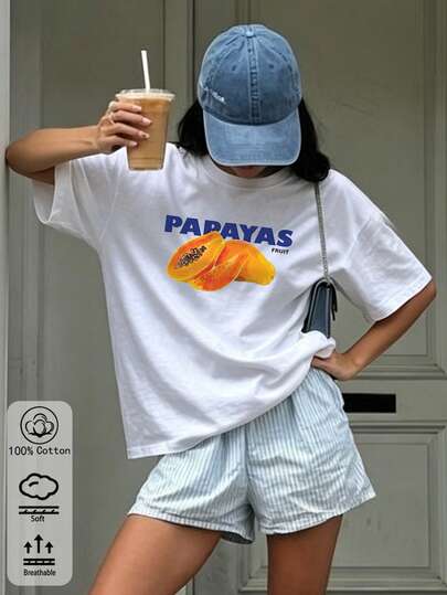 Camiseta feminina oversized branca de algodão com estampa de mamão: estilo streetwear casual, modelagem solta para o dia a dia, perfeita para o verão com tecido macio e respirável, design versátil para usar sozinha ou em camadas, ótima opção de presente.